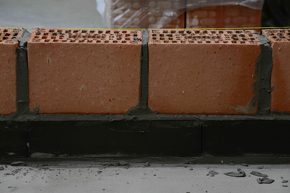 Insulation combined with a brick